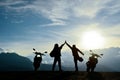 Motorbikers high five on mountain top Royalty Free Stock Photo