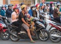 Motorbikers wait at traffic lights in Saigon city