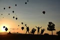 Motorbikers waving at hot air balloons