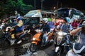 Motorbikes at a crossroads at night in Thailand