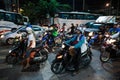 Motorbikes at a crossroads at night in Thailand