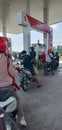 Motorbikes Queue Up for Fuel Royalty Free Stock Photo