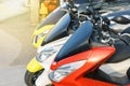 Motorbikes for rent parked in row in city street, Royalty Free Stock Photo