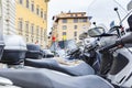 Motorbikes standing in the street in Florence