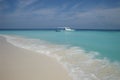 Motorboat anchoring at dreamlike barefoot island Royalty Free Stock Photo