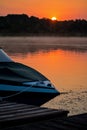 Motorboat At The Dock As The Sun Begins To Rise