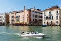 Motorboat on Grand canal. Foscari Palace, Palazzo Barbaro. Sunny day in Venice Royalty Free Stock Photo