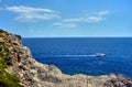 Motorboat on the rocky coast Royalty Free Stock Photo