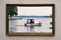 Motorboat on the Schwerin lake in the picture frame. Castle garden in Mecklenburg-Vorpommern