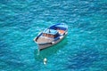 Motorboat swinging on water of Tyrrhenian sea, Ischia island - Italy Royalty Free Stock Photo