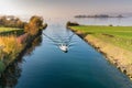 Motorboat with tourist people passes from the lower to the upper Lake Zurich through the locks and passage on the Seedamm near Rap