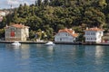 Motorboats moored in front of several Summer mansions on the shore of the south side of the Bosphorus Straits near Istanbul Royalty Free Stock Photo