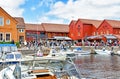 Motorboats navigate on a canal in the Fiskebrygga district in Kristiansand, Norway