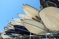 Motorboats racked one above another in a dry rack boat storage facility Royalty Free Stock Photo