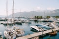 Motorboats and sailboats moored at the pier. Porto, Montenegro