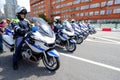 Motorcade of police motorcyclists is accompanied by a bicycle parade