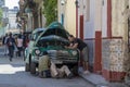 Mechanics try to repair classical car in street of Havana Royalty Free Stock Photo