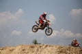 Motorcross riders jump