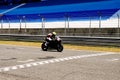 Black Motorcycle Arriving Finish Line, Victory, Motor Sports Royalty Free Stock Photo