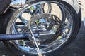 Motorcycle brake disc on the rear wheel, brake caliper and tire, shining chrome Royalty Free Stock Photo