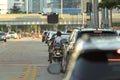 Motorcycle and cars traffic driving at intersection on American street with traffic lights in Miami, Florida. USA Royalty Free Stock Photo