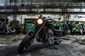 Motorcycle Chopper in an old industrial hall with graffiti urban