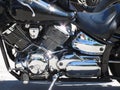 Motorcycle chromed engine closeup detail. Side view Royalty Free Stock Photo