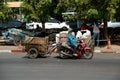 Motorcycle contractor Drag the cargo wheels that bulk cargo Thai-Cambodian border. Royalty Free Stock Photo