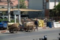 Worker drag the cargo wheels that bulk cargo at Thai-Cambodian border. Royalty Free Stock Photo