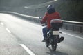 Motorcycle Courier On The Highway