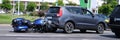 Motorcycle crashed into back of car on road closeup Royalty Free Stock Photo