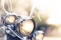 Motorcycle detail with headlamps in foreground Royalty Free Stock Photo