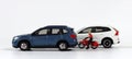 A motorcycle driver between a blue car and a white car. Royalty Free Stock Photo