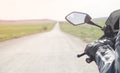 Motorcycle driver riding alone on asphalt motorway