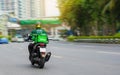 Motorcycle driver delivers food to customers who order online in Bangkok, Thailand 28-04-2020