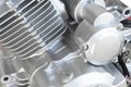 Motorcycle engine background. Air cooled internal combustion engine for motorcycle, snowmobile or ATV. Silver engine close up