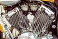 Motorcycle engine detail. Shiny, custom, chrome, stylish, yellow motorbike motor fragment Royalty Free Stock Photo