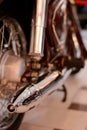 Motorcycle engine and exhaust pipe closeup. Retro bike shiny classic metal details