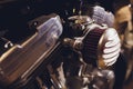 Motorcycle engine, metallic background with exhaust pipes. Royalty Free Stock Photo