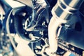 Motorcycle engine with model high heel boots Royalty Free Stock Photo