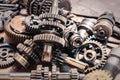 Motorcycle engine part , old Transmission Gears on rusty background . selective focus