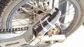 The motorcycle footrests are damaged, use cable ties to fasten them