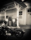 Motorcycle in front of old gas station