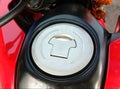 Motorcycle fuel oil tank cap on cement floor background closeup Royalty Free Stock Photo