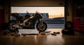 Motorcycle in Garage with Tools and Sunset View Royalty Free Stock Photo