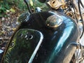 Motorcycle gas tank with rusty lid and glossy dusty body. Part of a motorcycle. Full screen photo Royalty Free Stock Photo