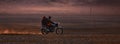 On a motorcycle in the Gobi desert. Dust from under the wheels. Wild Mongolian road. 06.09.2019. Gobi Desert, Mongolia