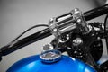 Motorcycle handle bar with blue tank Royalty Free Stock Photo