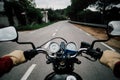 Motorcycle handlebar POV on road highway