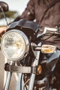 Motorcycle headlights with senior man steering Royalty Free Stock Photo